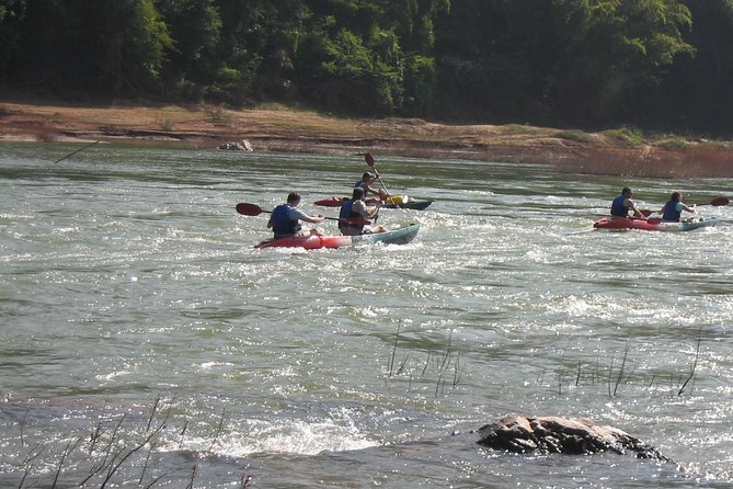 FULL DAY – Kuang Si Waterfall, Kayak on the Nam Ou / Mekong River, Pak Ou Caves - The Whisky Village Stop: A Brief Cultural Pause