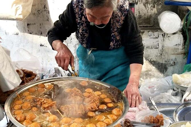 Luang Prabang Evening Food Tour by Tuk-Tuk - First stop at Wat Xiengthong, then straight into local streets