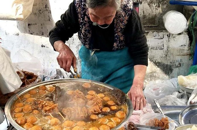 Luang Prabang Evening Food Tour by Tuk-Tuk - Hot pot at the table: hands-on cooking, charcoal heat, and fresh ingredients