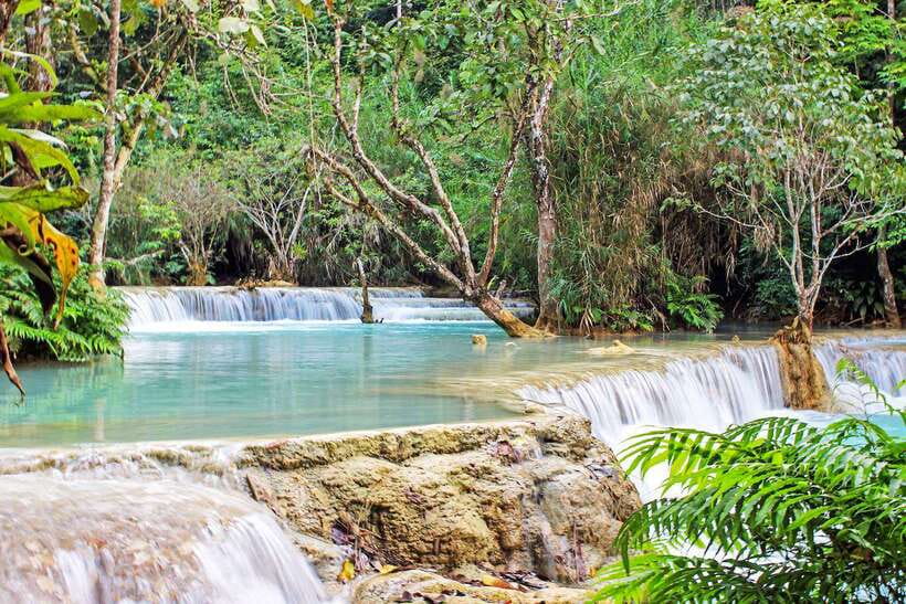 Luang Prabang: Kuang Si Bike Ride & Long-Tail Boat Cruise - Arriving at Kuang Si Waterfall: trails, pools, and real swim time