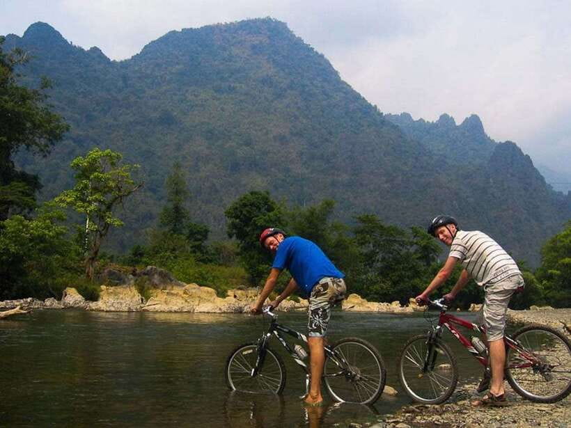 Vang Vieng: Blue Lagoon and Countryside Bike Tour with Lunch - Pickup, Off-Road Start, and the Nam Song River Bridge Moment